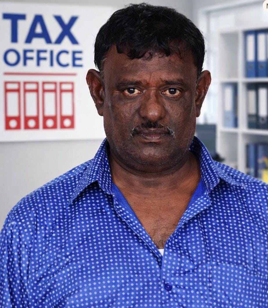 E. Arumugam